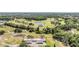 Scenic aerial view of a residential community with a golf course, ponds and lush green landscaping at 3839 Trophy Blvd # 3839, New Port Richey, FL 34655