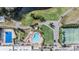Breathtaking aerial view of the community pool, golf course, tennis courts, and lush landscaping at 3839 Trophy Blvd # 3839, New Port Richey, FL 34655