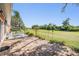 Paver patio with a view of the yard, with lush greenery and mature trees at 3839 Trophy Blvd # 3839, New Port Richey, FL 34655