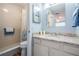 Bathroom featuring a tile shower, updated vanity, and a neutral color scheme at 3839 Trophy Blvd # 3839, New Port Richey, FL 34655