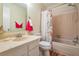 Bathroom with tile floors, tile shower and bath, and a sink and vanity at 3839 Trophy Blvd # 3839, New Port Richey, FL 34655