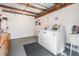 Functional laundry room featuring a washer, dryer, and utility sink for added convenience at 3839 Trophy Blvd # 3839, New Port Richey, FL 34655