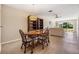 Open-concept living area and dining room with neutral walls and view to outdoor space at 3839 Trophy Blvd # 3839, New Port Richey, FL 34655