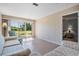 Spacious living room featuring access to outdoor space and view of bedroom at 3839 Trophy Blvd # 3839, New Port Richey, FL 34655