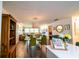 Open-concept dining area with modern lighting fixture and view into living spaces at 3850 13 N Ave # 113, St Petersburg, FL 33713