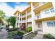 Exterior view of condo with lush landscaping and multiple balconies at 3850 13 N Ave # 113, St Petersburg, FL 33713