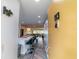 A long hallway with a view of the kitchen, living room, and outdoor patio. Unit 113 at 3850 13 N Ave # 113, St Petersburg, FL 33713
