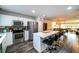 Charming kitchen with stainless steel appliances, white cabinetry, a center island, and open-concept living at 3850 13 N Ave # 113, St Petersburg, FL 33713