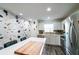 Kitchen features stainless steel appliances, modern white cabinets, and an accent wall at 3850 13 N Ave # 113, St Petersburg, FL 33713