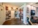 Cozy living room with built-in bookshelves and French doors leading to a bedroom at 3850 13 N Ave # 113, St Petersburg, FL 33713