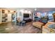 A spacious living room with open floor plan, blending comfort and style, and views of the kitchen at 3850 13 N Ave # 113, St Petersburg, FL 33713