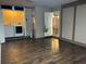 Spacious unfinished basement with wood look flooring and access to utility room at 3902 Shoreside Cir, Tampa, FL 33624