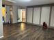 Spacious unfinished basement with wood look flooring and access to utility room at 3902 Shoreside Cir, Tampa, FL 33624