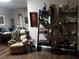 Cozy living room featuring decorative shelving with animal figures and tan armchair at 3902 Shoreside Cir, Tampa, FL 33624