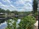 Scenic view of a community pond reflecting the sky and surrounding buildings at 3902 Shoreside Cir, Tampa, FL 33624