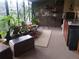 Cozy sunroom with potted plants, barstool seating, a serving counter, and an area rug at 3902 Shoreside Cir, Tampa, FL 33624
