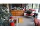 Bright sunroom with natural lighting, a large chest of drawers and a red gumball machine at 3902 Shoreside Cir, Tampa, FL 33624