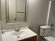 Bathroom featuring a single sink vanity, a large framed mirror and a standard toilet at 4008 Ashford Green Pl # F101, Tampa, FL 33613