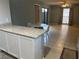 Bright dining area with tile flooring, seating, and a view of the kitchen with stainless appliances at 4008 Ashford Green Pl # F101, Tampa, FL 33613