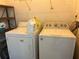 Functional laundry area with standard washer and dryer, providing essential convenience for residents at 4008 Ashford Green Pl # F101, Tampa, FL 33613