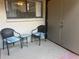 Patio with two chairs and a small table in a sunlit outdoor space at 4008 Ashford Green Pl # F101, Tampa, FL 33613