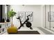 Comfortable exercise room with a stationary bike, shelving, and a stylish design at 4014 Northern Key Dr, Plant City, FL 33563