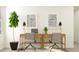 Bright home office with two desks, modern chairs, indoor plants, and neutral decor for an efficient work space at 4014 Northern Key Dr, Plant City, FL 33563