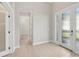 A spacious entryway featuring a tiled floor and glass panel doors at 4325 Barletta Ct, Wesley Chapel, FL 33543