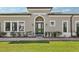 Home with a well-manicured lawn and garden, complemented by a neutral-colored exterior at 4325 Barletta Ct, Wesley Chapel, FL 33543