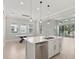 Modern open kitchen with stainless steel appliances and a view of the dining area at 4325 Barletta Ct, Wesley Chapel, FL 33543