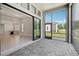 Covered lanai with views of the open-concept living space and backyard at 4325 Barletta Ct, Wesley Chapel, FL 33543