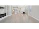 Open floor plan featuring a living room that flows into a modern kitchen with pendant lighting at 4325 Barletta Ct, Wesley Chapel, FL 33543