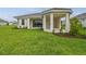 A well maintained backyard with a patio and lush green grass at 4709 Isonzo Way, Wesley Chapel, FL 33543
