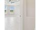 Bright bedroom with tile floors, large windows, and abundant natural light at 4709 Isonzo Way, Wesley Chapel, FL 33543