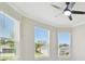 Bright bedroom with natural light, ceiling fan, and crown molding at 4709 Isonzo Way, Wesley Chapel, FL 33543