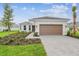 Charming single-story home with brick driveway and manicured landscaping at 4709 Isonzo Way, Wesley Chapel, FL 33543