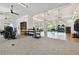 Large gym offers exercise machines, free weights, and floor-to-ceiling windows at 4709 Isonzo Way, Wesley Chapel, FL 33543