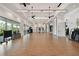 Exercise room offers large windows providing natural light and tropical views at 4709 Isonzo Way, Wesley Chapel, FL 33543