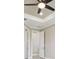 Hallway featuring modern light fixtures and views of the doorways and ceiling fan at 4709 Isonzo Way, Wesley Chapel, FL 33543