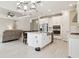 Open floor plan kitchen with island seating and stainless appliances perfect for entertaining and everyday living at 4709 Isonzo Way, Wesley Chapel, FL 33543