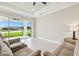 Bright living room with sliding glass doors leading to the outdoors and comfortable seating at 4709 Isonzo Way, Wesley Chapel, FL 33543