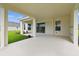 Covered patio with plenty of space and easy access from the interior at 4709 Isonzo Way, Wesley Chapel, FL 33543
