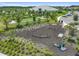 Community playground with modern equipment, soft mulch ground cover, and surrounded by lush landscaping at 4709 Isonzo Way, Wesley Chapel, FL 33543