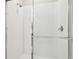 A close-up of the shower, highlighting the white subway tile and modern shower head at 4709 Isonzo Way, Wesley Chapel, FL 33543