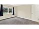 Bedroom featuring neutral colored walls and a new carpet at 4801 Airport Rd # 210, Zephyrhills, FL 33542