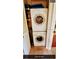 Compact laundry closet with stacked white washer and dryer units at 4801 Airport Rd # 210, Zephyrhills, FL 33542
