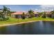 Beautiful backyard and lake view, showcasing the serene outdoor space and waterfront property at 4821 Grand Banks Dr, Wimauma, FL 33598
