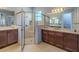 Stylish bathroom offering a glass shower enclosure and ample counter space at 4821 Grand Banks Dr, Wimauma, FL 33598