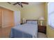 Bedroom with blue accents and soft lighting creates a calm and inviting space at 4821 Grand Banks Dr, Wimauma, FL 33598