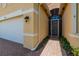 A home featuring a brick entryway and white garage door creates a welcoming facade at 4821 Grand Banks Dr, Wimauma, FL 33598